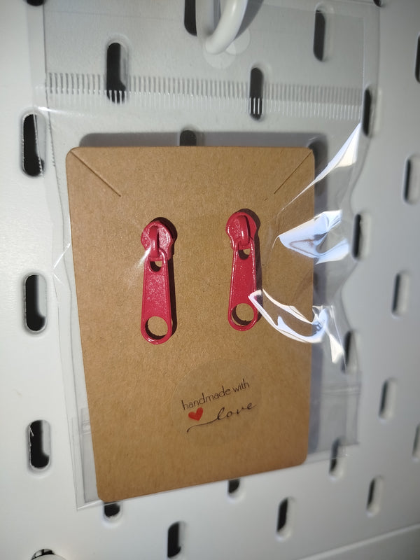 Orecchini con cerniere colorate